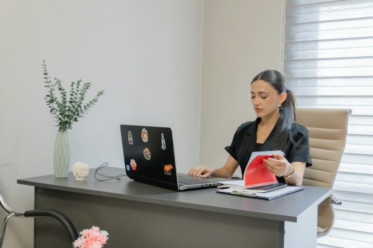 AI for life insurance agents: professional reviewing follow-up tasks on a laptop (illustrative stock photo)