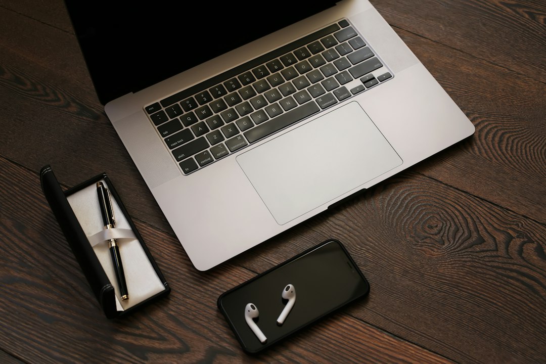 Laptop and smartphone illustrating ElevenLabs WhatsApp Business AI agent configuration